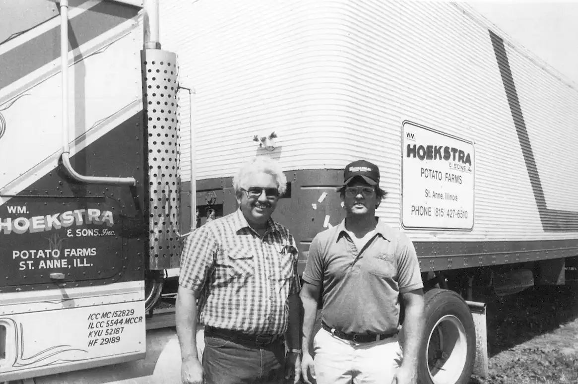 Old Photo of Founder WM. Hoekstra & Son standing in front of Hoekstra Semi Truck